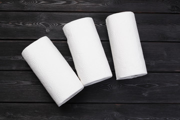 Roll of paper towel on wooden background