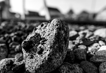 Fototapeta premium Stones on the edge of the asphalt road