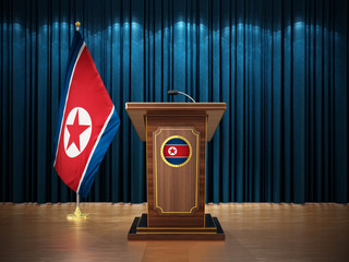 Press conference with flags of North Korea and lectern against the blue curtain. 3D illustration