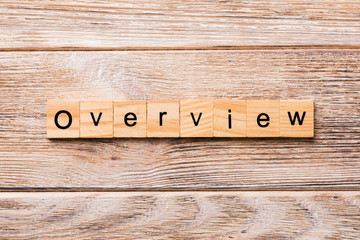 OVERVIEW word written on wood block. OVERVIEW text on wooden table for your desing, concept
