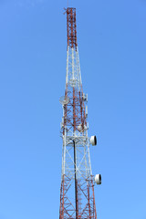 Fototapeta na wymiar Wireless Communication Antenna With bright sky.Telecommunication tower with antennas with blue sky.