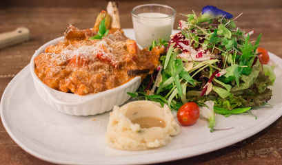 Pork Chop French Cut with Sauce, Organic Salad and Mashed potato with Gravy at Ohkajhu organic restaurant.