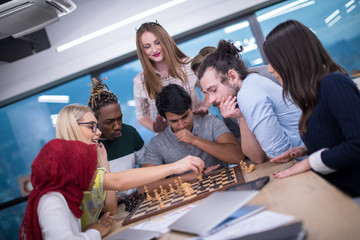 multiethnic group of business people playing chess
