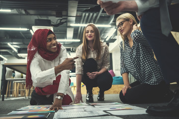black muslim woman having meeting with Multiethnic  startup business team
