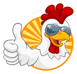 A chicken rooster cockerel bird cartoon character in cool shades or sunglasses giving a thumbs up © Christos Georghiou