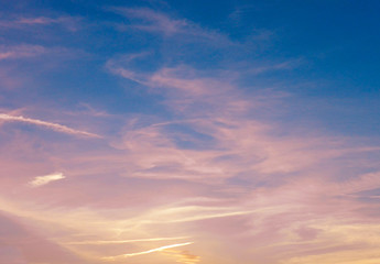 Cloudscape. Beautiful sky. Colorful dramatic sky with clouds at sunset. Bright blue, pink, orange and yellow colors of sunset / sunrise. Sunset abstract 