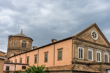 Italy, Rome, a large brick church with a clock tower