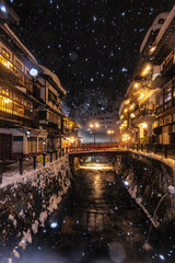 Fototapeta na wymiar Ginzan onsen with snow fall in Winter,, Japan