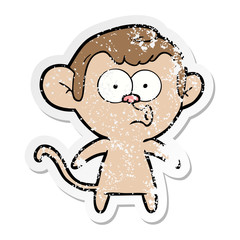 distressed sticker of a cartoon hooting monkey