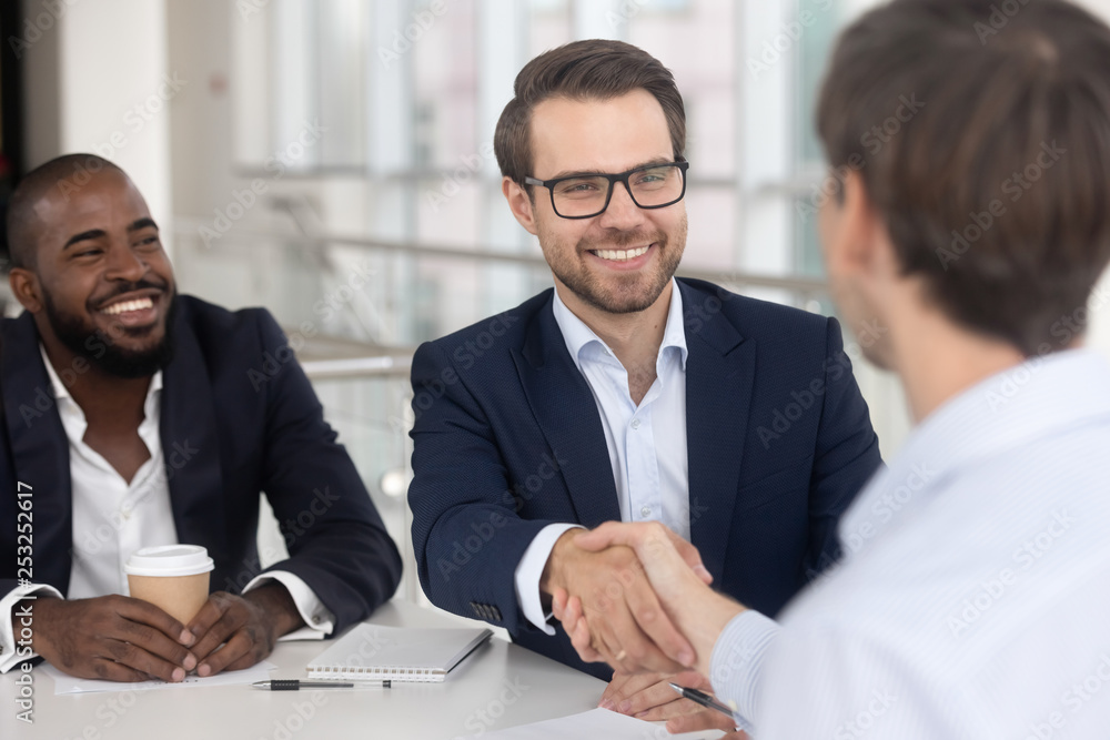 Poster Positive diverse business partners shaking hands starting meeting