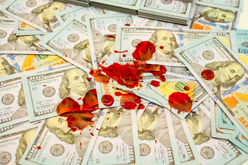 Stack bundles of 100 US dollars banknotes bloody