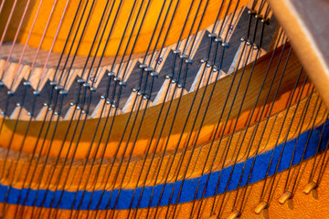 piano strings interior life inner working golden closeup