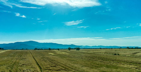 Italy, Rome to Florence train, a large green field