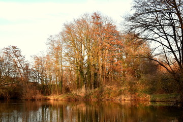 Evening, sunset, river, reflection of clouds in the water, the rays of the sun. River Else.Kirchlenger Germany.