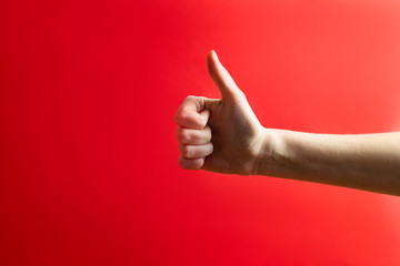 Thumbs up, approval gesture concept. Hand showing a 