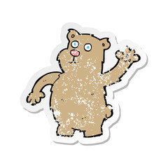 retro distressed sticker of a cartoon waving bear
