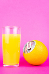 Orange juice on pink background
