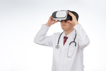 Male doctor wearing virtual reality glasses isolated on white background.