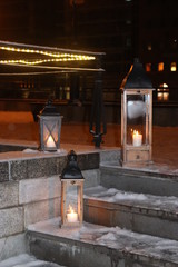 Candle in a candlestick on the street.