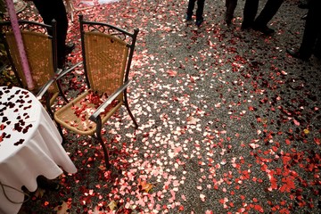 Heart shaped red confetti on the ground.