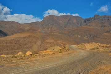 Mountain road from Khasab to Dibba on the background of a beautiful landscape. Musandam Peninsula. Oman
