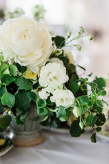 wedding table decorated by plates, knives and forks