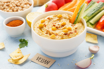 Hummus dip served with fresh vegetable sticks.