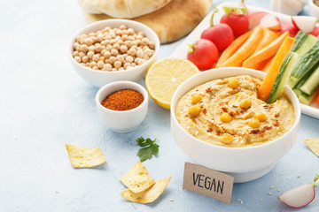 Hummus dip served with fresh vegetable sticks.