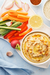 Hummus and variety of vegetable sticks. Healthy snacks.