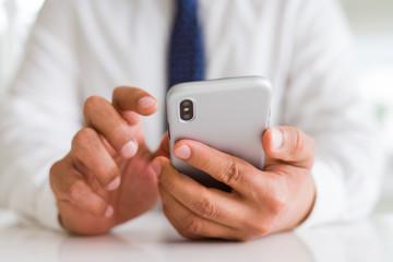 Close up of business man hands using smarpthone