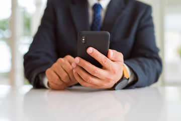 Close up of business man hands using smarpthone