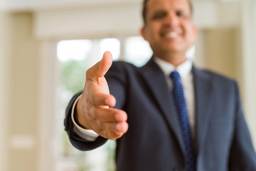 Close up of business man handing hand, meeting concept