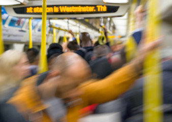 Subway full of blurred people in London