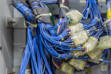 The background of the electronic equipment set (power cord, plug), inside the elevator kit, for machine improvement, to be able to use again. 