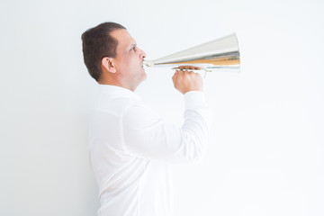 Middle age man shouting through a megaphone