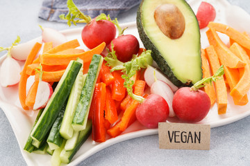 Mixed fresh vegetable sticks. Vegan snack concept.