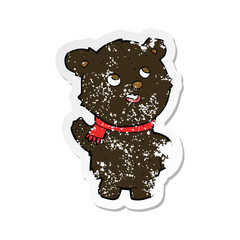 retro distressed sticker of a cartoon cute black bear cub