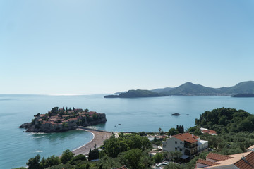 Panoramic view of the Adriatic Sea in Montenegro. Island Sveti Stefan and mountains in the background.