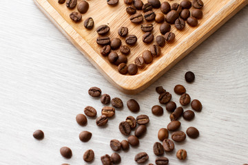 coffee grains on a wooden plate