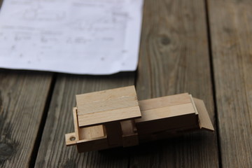 Child's hand, fold and stick a wooden toy