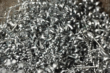 A lot of metal shavings after working on a milling machine or CNC machine. Metal shavings texture