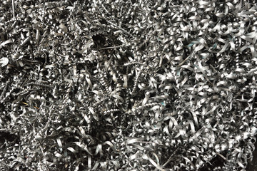 A lot of metal shavings after working on a milling machine or CNC machine. Metal shavings texture