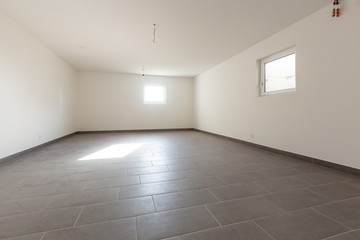Cellar with gray tiles and white walls