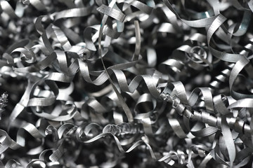 A lot of metal shavings close-up, after working on a milling machine or CNC machine. Texture metal...
