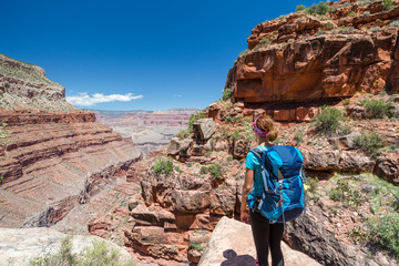 Hiker woman hiking in Grand Canyon. Healthy active lifestyle image of hiking young multiracial...