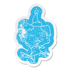cartoon distressed sticker of a dancing dog wearing santa hat