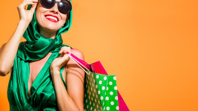 Beautiful caucasian shopping woman holding shopping bags