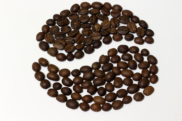 Roasted coffee beans isolated on white background.