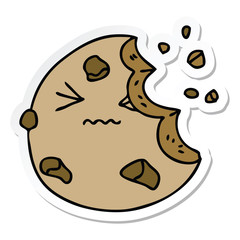 sticker of a quirky hand drawn cartoon munched cookie