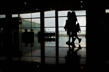 Airport terminal hall with some travelers